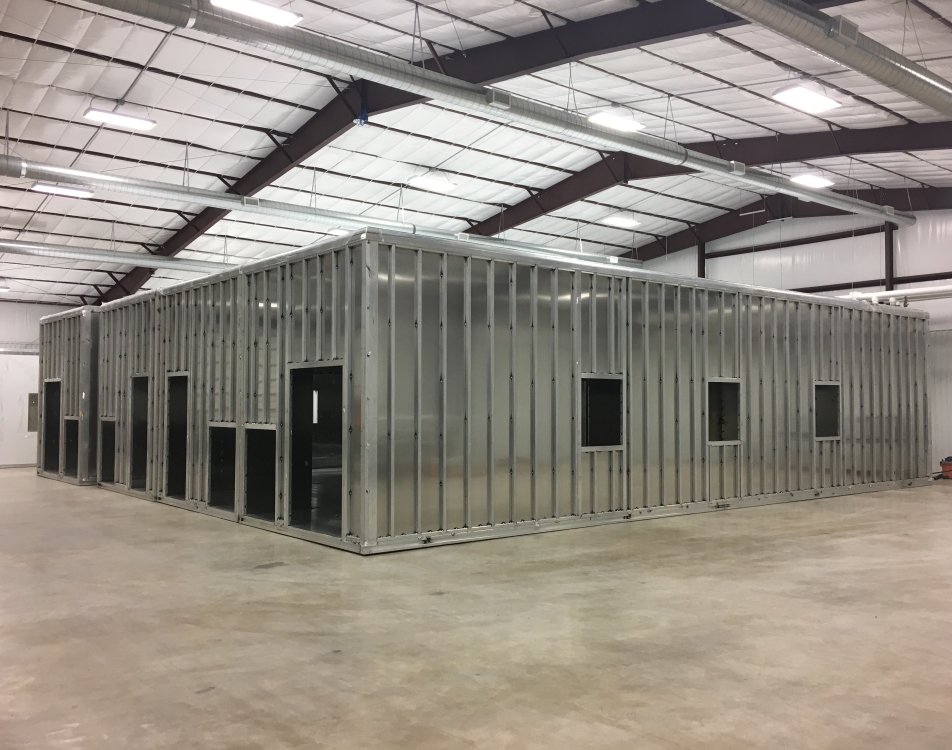 The exterior of an incomplete POD cleanroom inside the facility.