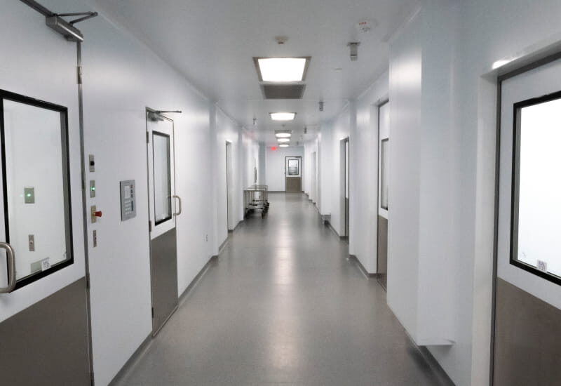 Inside a POD hallway showcasing muliple doors to different rooms.