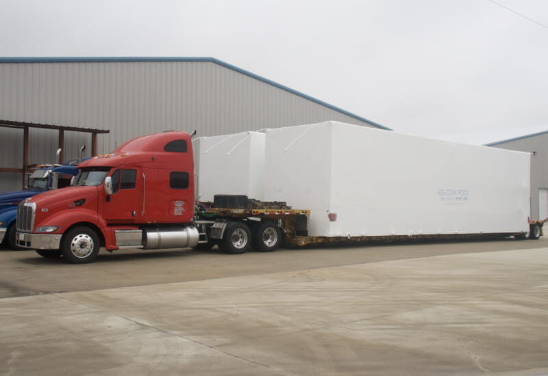 18 wheelers ready to transport several PODs.